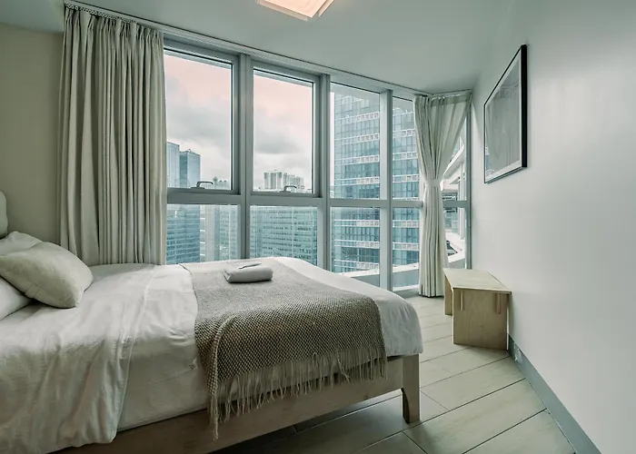 Golden Japandi 2br Uptown Parksuits Bgc With Dryer Manila